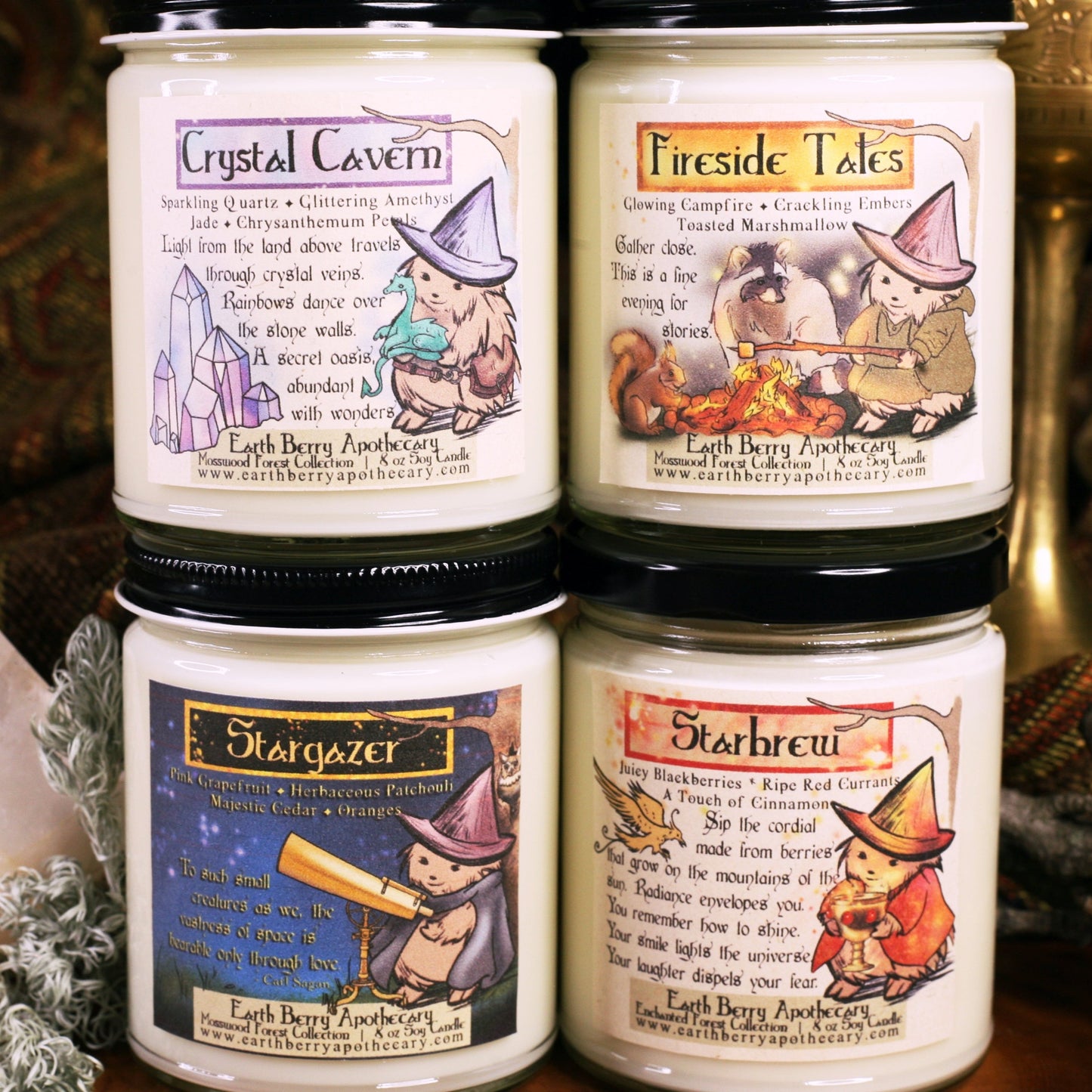 Set of 4 summer soy candles, nontoxic and clean burning. Crystal Cavern, Fireside Tales, Stargazers, and Starbrew are stacked and sitting in front of a fantasy background. Each label has the hedge witch doing her daily life