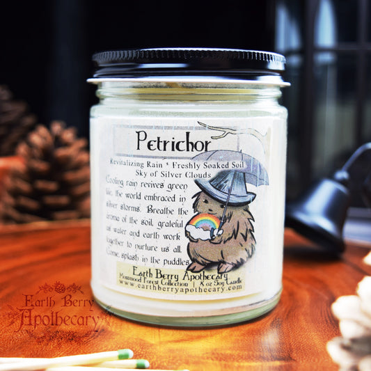 Earthy rain scented candle called petrichor. Fantasy nature candle with a rainbow.