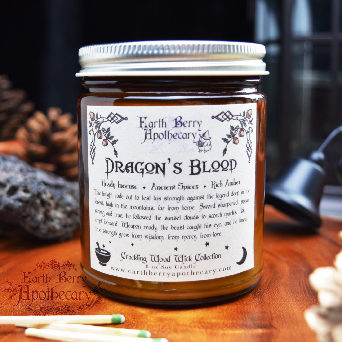 Dragons blood candle in an amber jar with a crackling wood wick