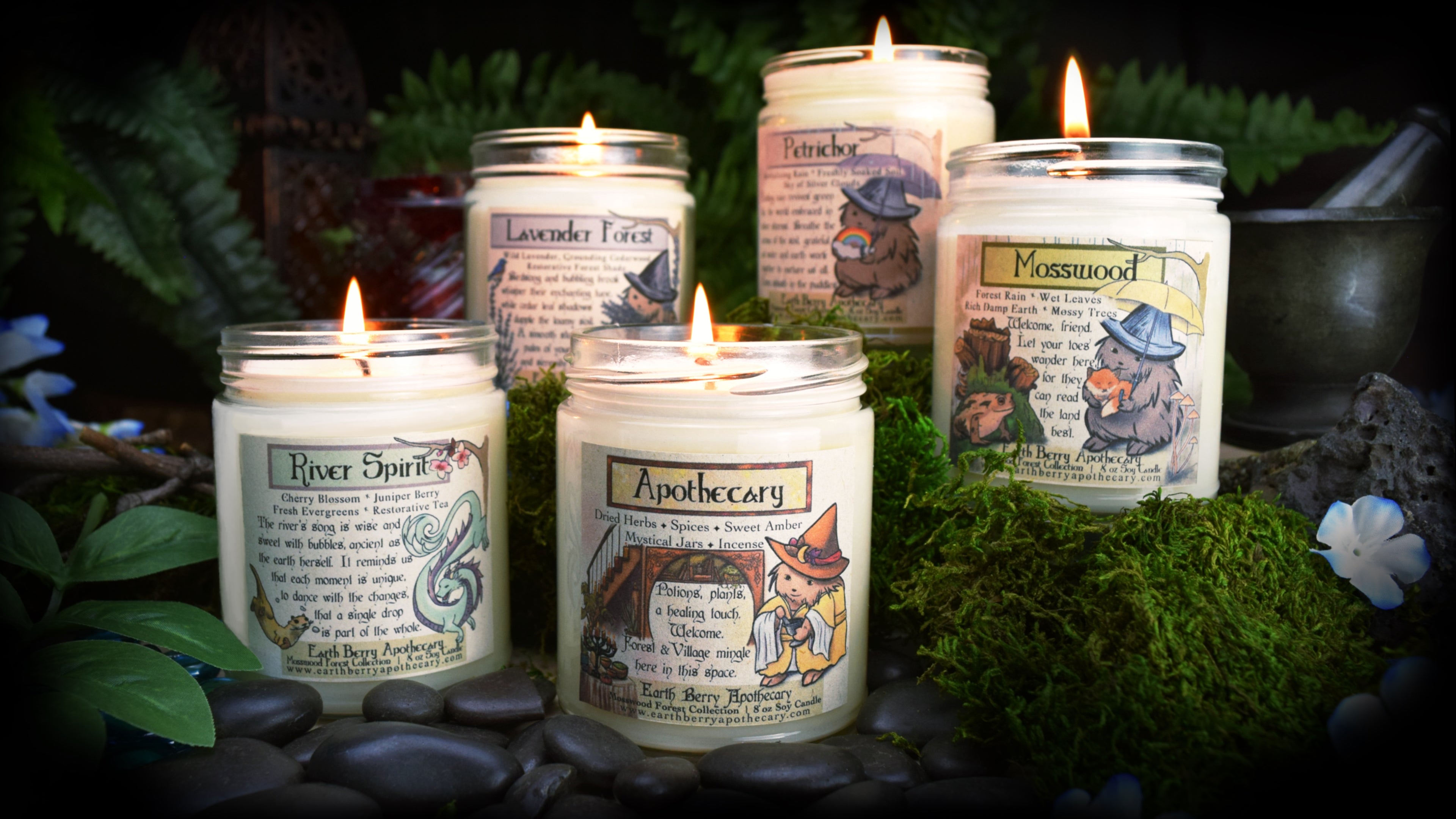 A beautiful set of illustrated fantasy candles, with harmony hedge witch or a water dragon.