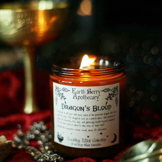 Dragons blood scented crackling wood wick candle.