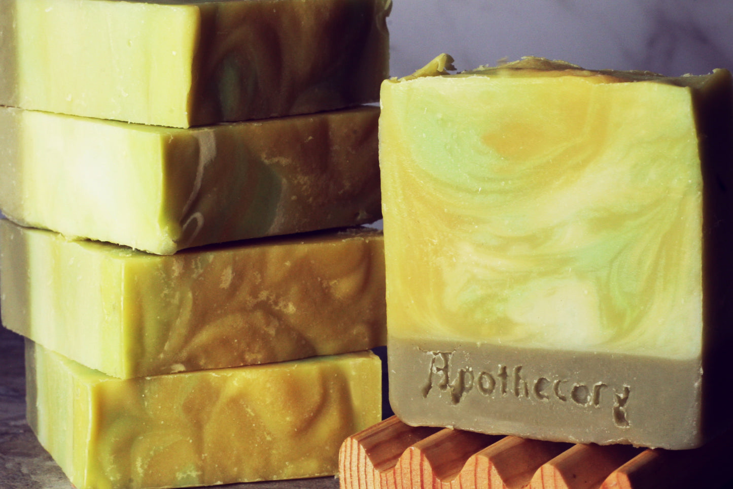 yellow and grey layered handmade soap scemted with stone moss and forest