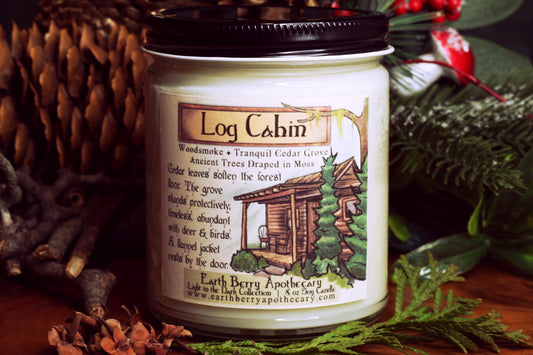 Log Cabin cedar, woodsmoke, and moss scented soy candle. Always clean burning, and nontoxic.