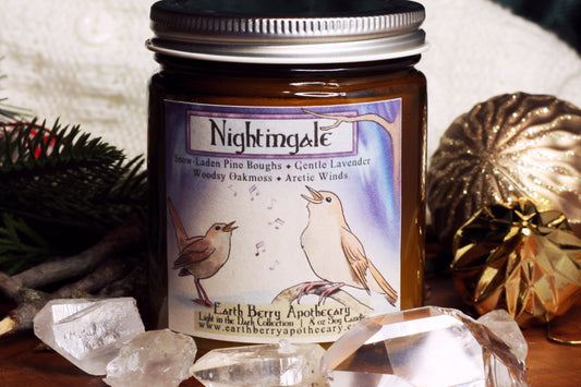 Nightingale crackling wood wick soy candle scented with pine, cedar, Aurora borealis, lavender, and oakmoss. Always clean burning and nontoxic