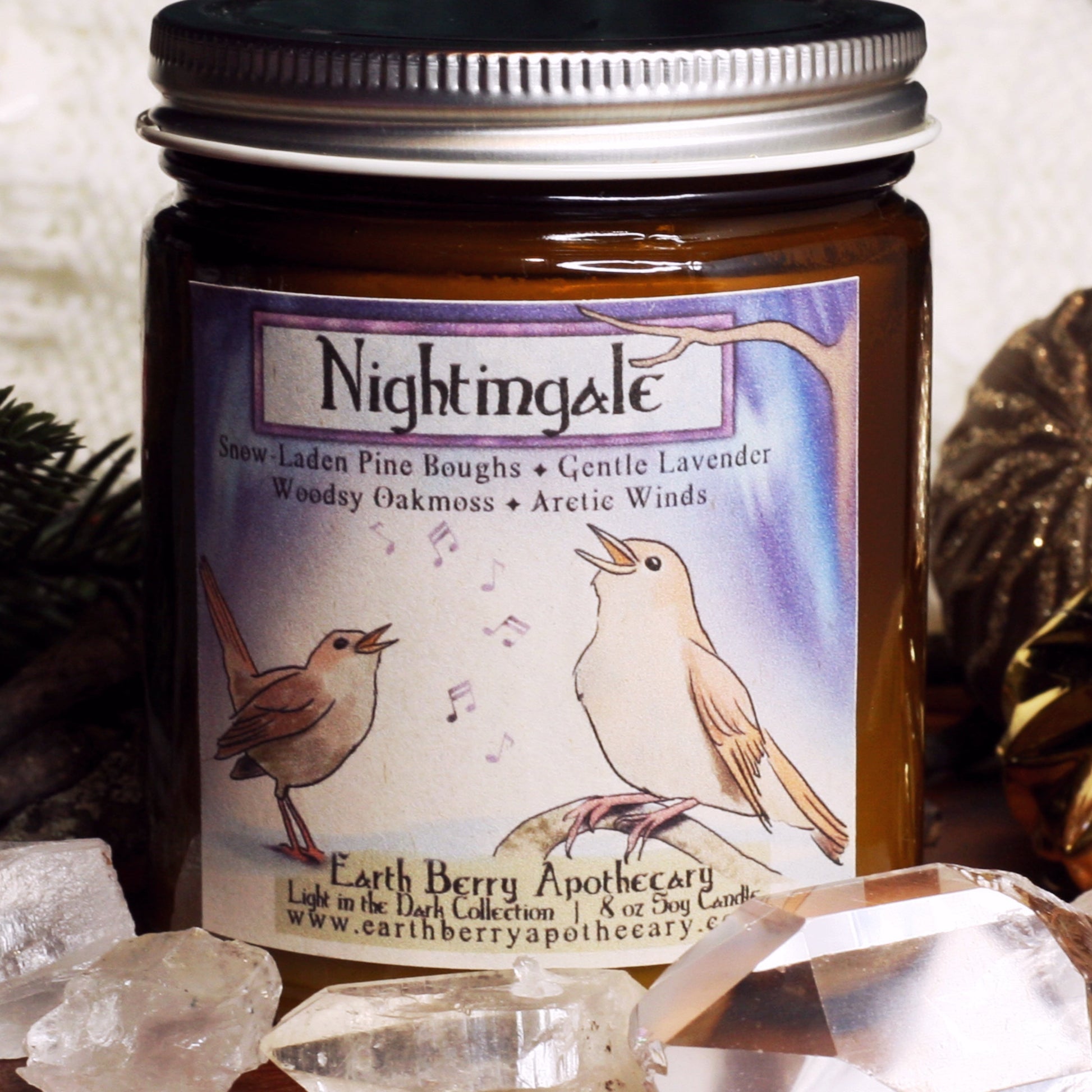 Nightingale crackling wood wick soy candle scented with pine, cedar, Aurora borealis, lavender, and oakmoss. Always clean burning and nontoxic