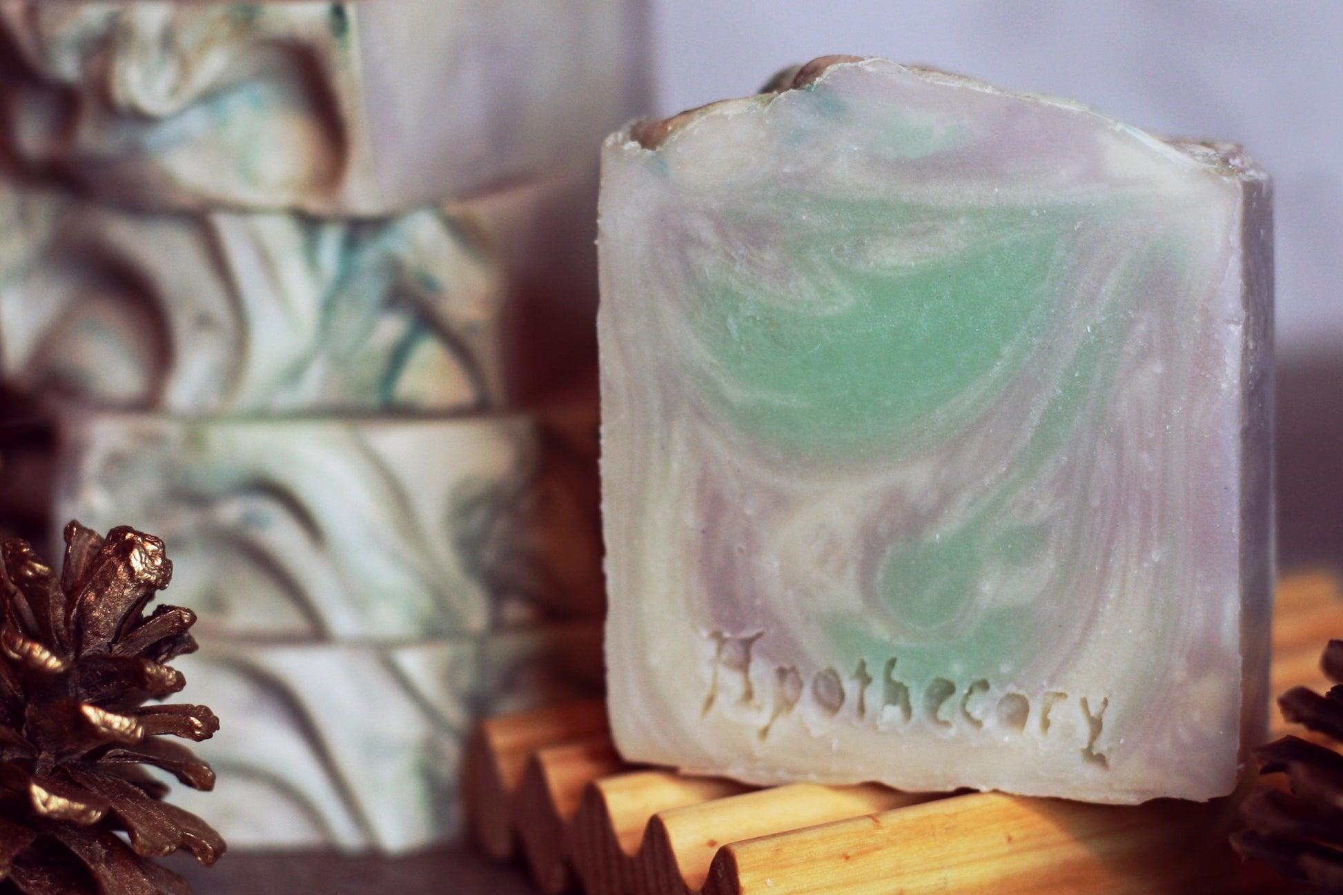 Nightingale pine and lavender scented handmade soap swirled with sea green, white, and purple