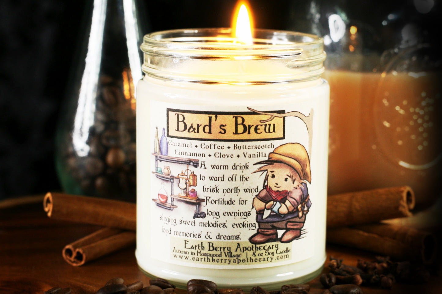 Bards brew candle has a fantasy tavern bar with a kind hedgehog bartender wiping a clean glass. The scent is coffee caramel butterscotch cinnamon clove and vanilla
