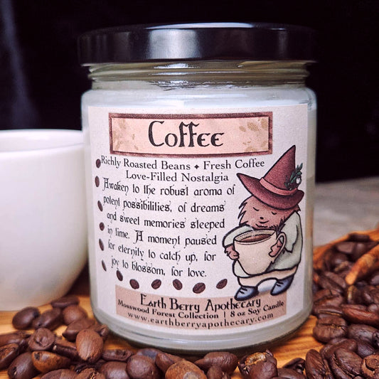 Candle jar labeled 'Coffee' with a cartoon hedgehog wearing a witch hat and clothes on a background of coffee beans and a cup.
