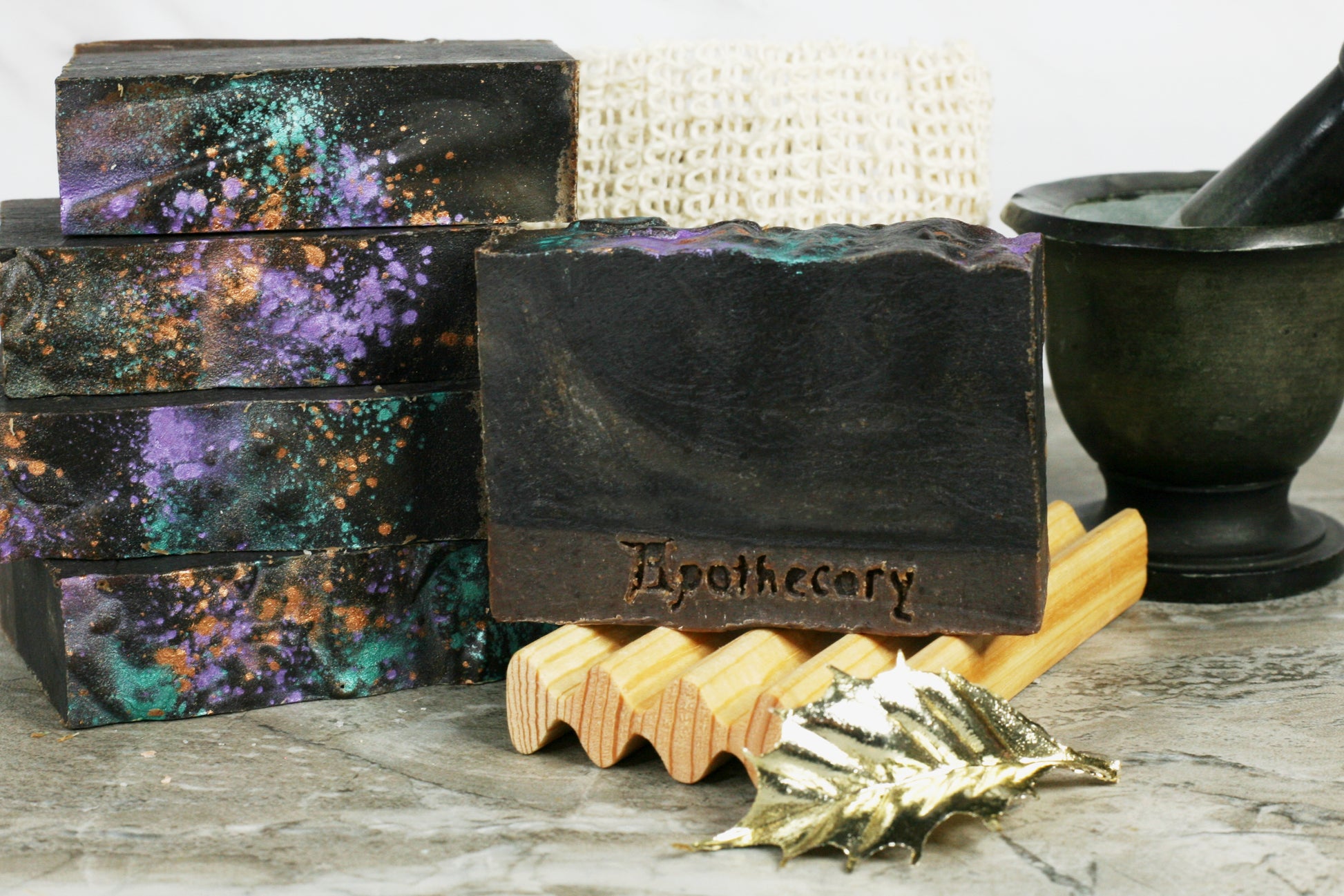 charcoal black moisturizing milk soap with sparkly top. the scent is Morgana, a creamy cardamom and tea scent