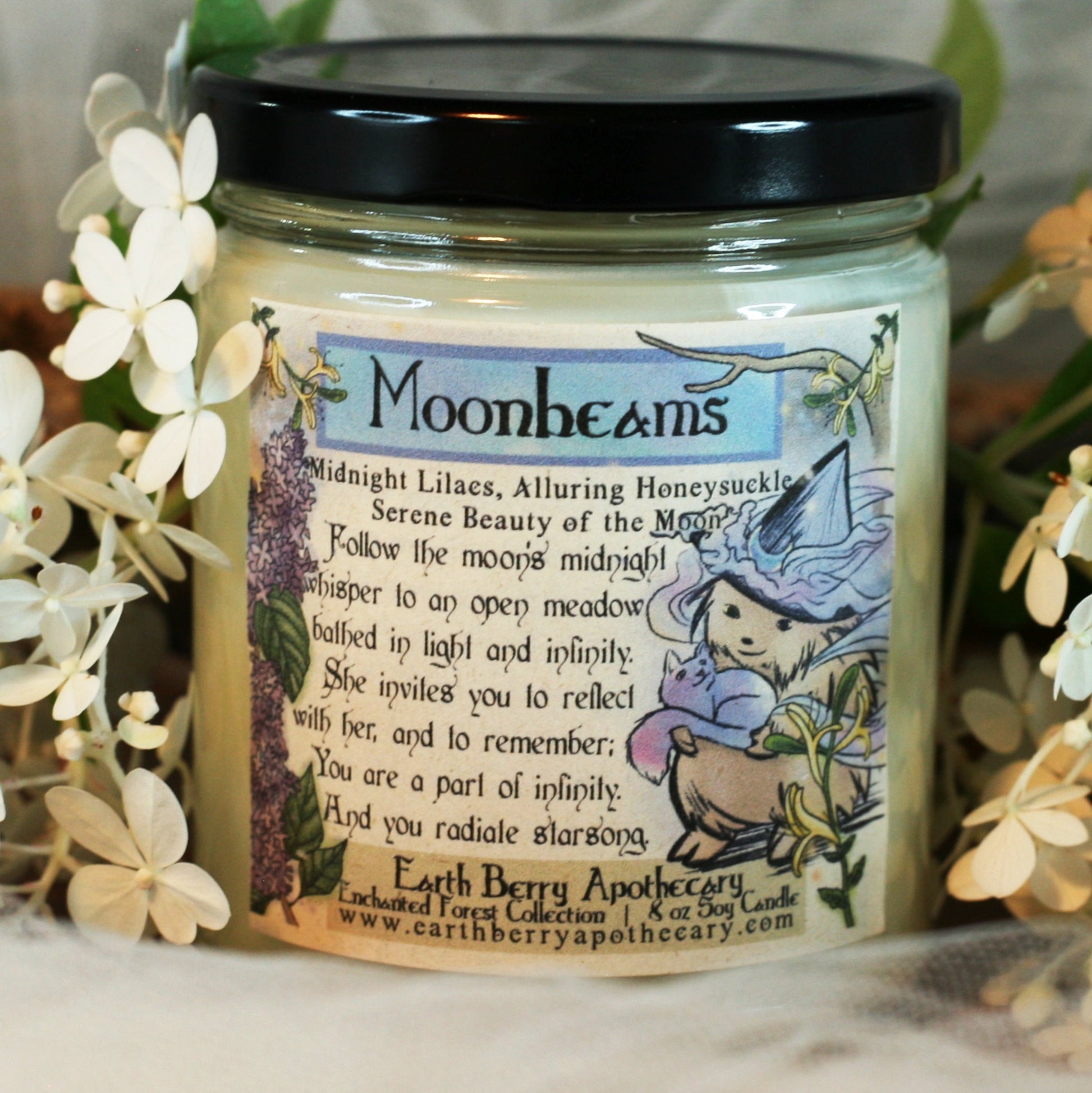 Moonbeams fantasy themed candle with lilac and honeysuckle scent.