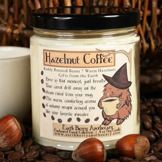 Hazelnut coffee scented soy candle. The hedge witch enjoys a steaming cup of coffee.